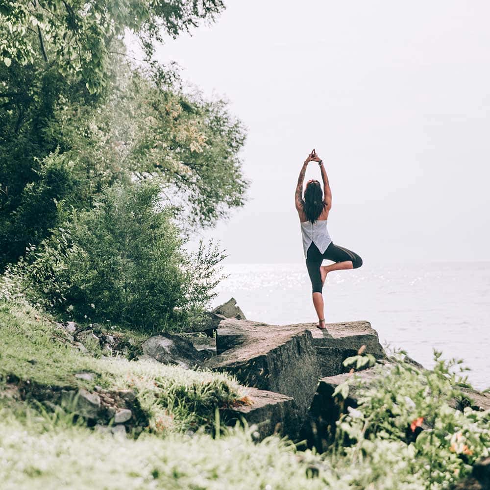 lady performing yoga in nature